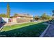 Large backyard with grassy area, patio, and shed at 21 W Del Rio Dr, Tempe, AZ 85282