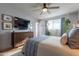 Main bedroom with wood dresser and large TV at 21 W Del Rio Dr, Tempe, AZ 85282