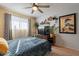 Bedroom with comfy bed, ceiling fan, and stylish decor at 21 W Del Rio Dr, Tempe, AZ 85282