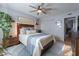 Bright bedroom with wood bed frame, and ceiling fan at 21 W Del Rio Dr, Tempe, AZ 85282