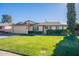 Ranch style home with a two-car garage and well-manicured lawn at 21 W Del Rio Dr, Tempe, AZ 85282