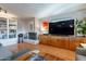 Living area with fireplace, wood media console, and hardwood floors at 21 W Del Rio Dr, Tempe, AZ 85282