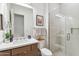 Contemporary bathroom with a floating vanity and glass shower at 23491 N 125Th Pl, Scottsdale, AZ 85255