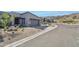 Modern home exterior with desert landscaping and two-car garage at 23491 N 125Th Pl, Scottsdale, AZ 85255