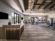 Community fitness center featuring modern equipment, wood floors and mountain views at 23491 N 125Th Pl, Scottsdale, AZ 85255