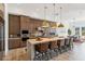 Modern kitchen with wood cabinets, a large island, and stainless steel appliances at 23491 N 125Th Pl, Scottsdale, AZ 85255