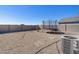 Expansive gravel backyard with block wall, trampoline, and air conditioning unit at 24134 N Cotton Cir, Florence, AZ 85132