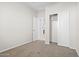 Carpeted bedroom with a closet and views to the hallway and the closet at 24134 N Cotton Cir, Florence, AZ 85132