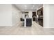 Bright, open kitchen featuring dark cabinetry, granite countertops, and a functional island at 24134 N Cotton Cir, Florence, AZ 85132