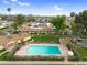 Aerial view of community with pool, surrounded by lush greenery and homes at 2442 N 22Nd Ave, Phoenix, AZ 85009