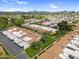 Sprawling community with green spaces, covered parking, and scenic mountain views in the distance at 2442 N 22Nd Ave, Phoenix, AZ 85009