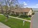 Charming single-story home with a well-manicured lawn, mature trees, and inviting curb appeal at 2442 N 22Nd Ave, Phoenix, AZ 85009