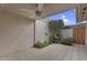 Covered patio area with ceiling fan and view of lush desert plants at 2442 N 22Nd Ave, Phoenix, AZ 85009