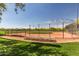 Community baseball field with well-maintained diamond and seating, perfect for sports and recreation at 25948 W Sands Dr, Buckeye, AZ 85396