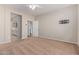 This bedroom features an adjacent bathroom and a mounted TV bracket on the wall at 25948 W Sands Dr, Buckeye, AZ 85396