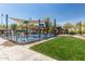 Community park with playground, splash pad, shade canopies, and picnic areas at 25948 W Sands Dr, Buckeye, AZ 85396