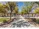 Community park with playground, splash pad, picnic areas, and mature trees at 25948 W Sands Dr, Buckeye, AZ 85396