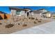 Charming home featuring desert landscaping, rock accents, and a two-car garage at 25948 W Sands Dr, Buckeye, AZ 85396