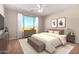 Calming main bedroom featuring natural light, modern décor, and a neutral color palette at 25948 W Sands Dr, Buckeye, AZ 85396