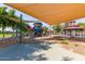 Community playground offers a large covered area with a climbing structure and more fun outdoor activities at 25948 W Sands Dr, Buckeye, AZ 85396