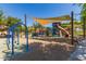 Bright and fun community playground with swings, slides, and covered play areas for endless outdoor adventures at 25948 W Sands Dr, Buckeye, AZ 85396