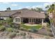 Aerial view of a house with backyard and golf course in the background at 27379 N Makena Pl, Peoria, AZ 85383