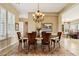 Formal dining room with elegant chandelier and seating for six at 27379 N Makena Pl, Peoria, AZ 85383