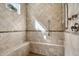 Large walk-in shower with tiled walls, built-in seat, and multiple shower heads at 27379 N Makena Pl, Peoria, AZ 85383