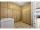 Large storage room with floor-to-ceiling built-in cabinets at 27379 N Makena Pl, Peoria, AZ 85383