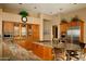 Spacious kitchen with granite countertops and wood cabinets at 28492 N 95Th Pl, Scottsdale, AZ 85262