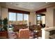 Relaxing living room with leather furniture and mountain views at 28492 N 95Th Pl, Scottsdale, AZ 85262