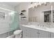 Modern bathroom with white vanity, walk-in shower, and marble tile at 2929 W Yorkshire Dr # 1118, Phoenix, AZ 85027