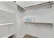 Spacious closet with shelves and hanging rods at 2929 W Yorkshire Dr # 1118, Phoenix, AZ 85027