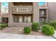 Exterior view of condo building showcasing landscaping and private entrance at 2929 W Yorkshire Dr # 1118, Phoenix, AZ 85027