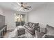 Living room with comfy gray couch and sliding door to patio at 2929 W Yorkshire Dr # 1118, Phoenix, AZ 85027