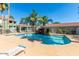 Refreshing community pool with waterfall feature and lounge chairs at 2929 W Yorkshire Dr # 1118, Phoenix, AZ 85027