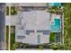 Overhead view of a home with a pool, landscaping, neighborhood, solar panels, and outdoor recreational facilities at 2967 E Boot Track Trl, Gilbert, AZ 85296