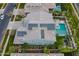 Aerial view showcasing a home with solar panels, garden, pool, landscaping, and neighborhood amenities at 2967 E Boot Track Trl, Gilbert, AZ 85296