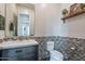 This is a well appointed powder room with a vessel sink and patterned tile at 2967 E Boot Track Trl, Gilbert, AZ 85296