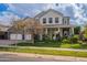 Charming two-story home with landscaped lawn, multiple windows, and inviting front porch at 2967 E Boot Track Trl, Gilbert, AZ 85296