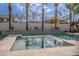 Tranquil hot tub with decorative water features and view of the manicured backyard at 2967 E Boot Track Trl, Gilbert, AZ 85296