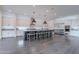 Spacious, open-concept kitchen featuring an oversized island, stainless steel appliances, and modern pendant lighting at 2967 E Boot Track Trl, Gilbert, AZ 85296