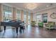 Elegant living room featuring a grand piano, stylish chairs, and lots of natural light at 2967 E Boot Track Trl, Gilbert, AZ 85296