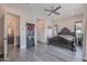 This main bedroom includes decorative wood floors and a ceiling fan at 2967 E Boot Track Trl, Gilbert, AZ 85296