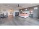 Spacious main bedroom featuring a desk, hardwood floors, and gray accent wall at 2967 E Boot Track Trl, Gilbert, AZ 85296