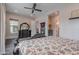 This is a bright and airy main bedroom with a ceiling fan and neutral walls at 2967 E Boot Track Trl, Gilbert, AZ 85296