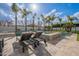 Relaxing poolside lounge area with comfortable seating, a sparkling pool, and lush landscaping at 2967 E Boot Track Trl, Gilbert, AZ 85296