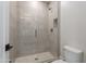 Walk-in shower with tiled walls, frameless glass door and built-in niche at 2967 E Boot Track Trl, Gilbert, AZ 85296