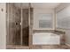 Bathroom with a shower, a soaking tub, and tiled accents at 302 E Coral Gables Dr, Phoenix, AZ 85022