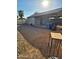 Large backyard with gravel and trash cans at 3133 W Polk St, Phoenix, AZ 85009